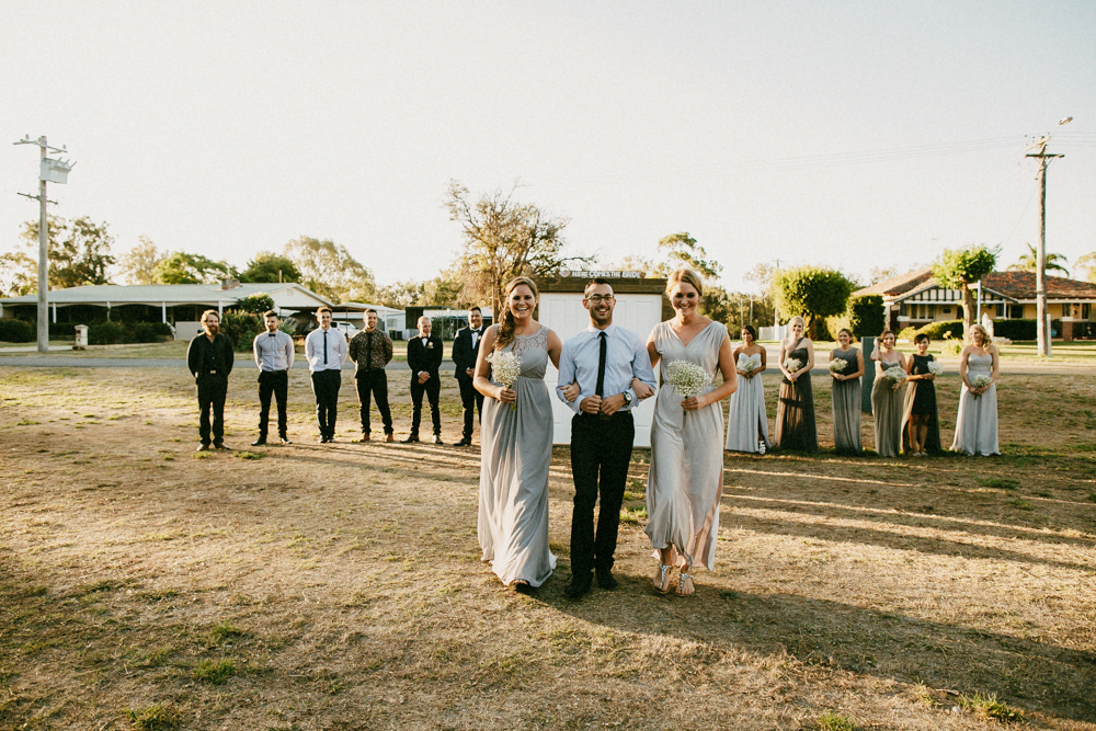 bridesmaid groomsmen marching in